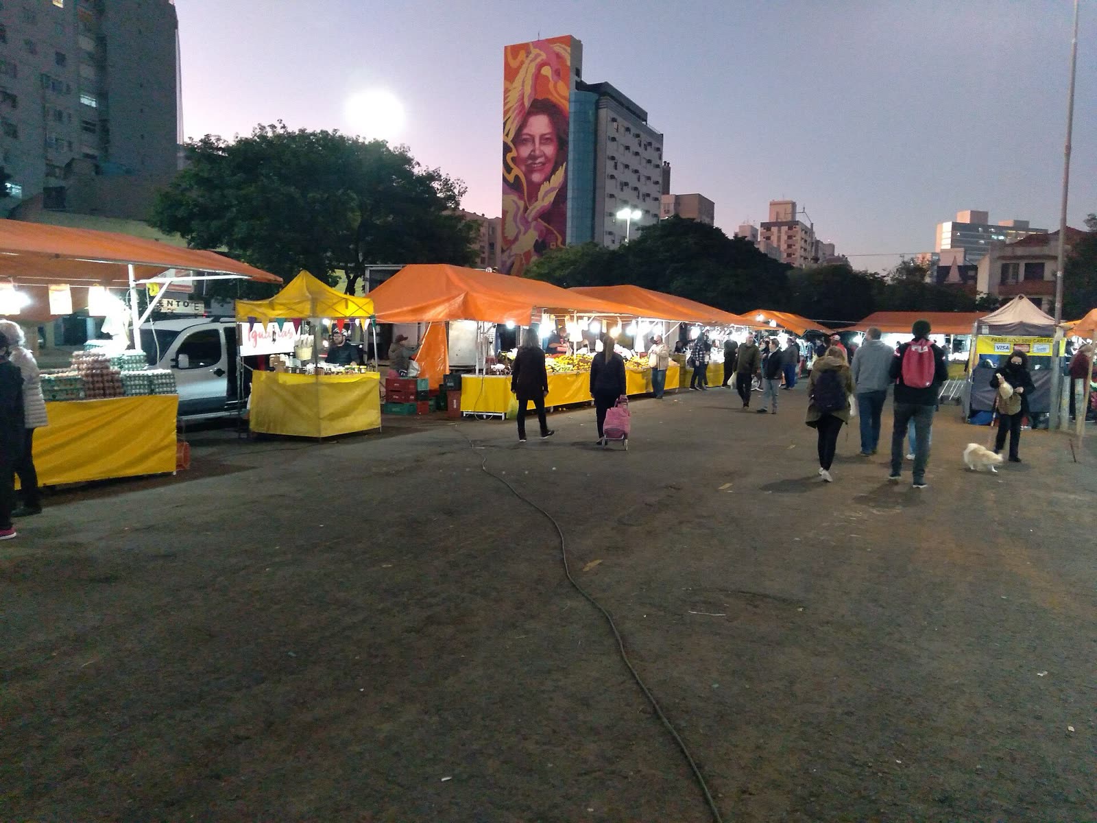 Orange awnings of an evening street market, Porto Alegre